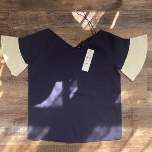 NWT Ann Taylor: dark navy blue top with off white sleeve detailing